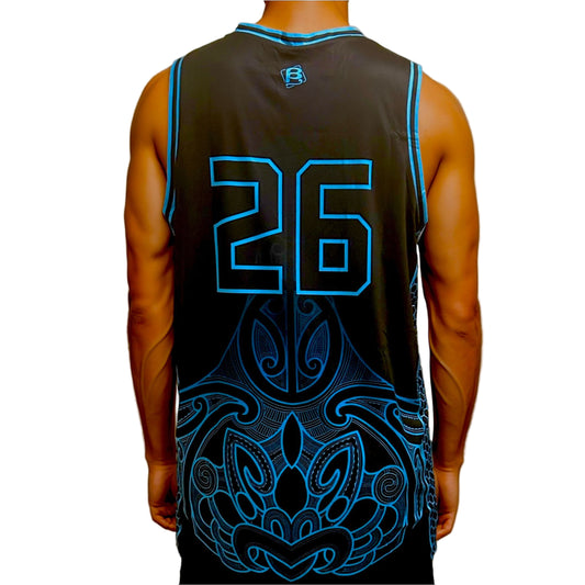 Person wearing a black basketball jersey with blue numbering and Maori patterns on a plain background